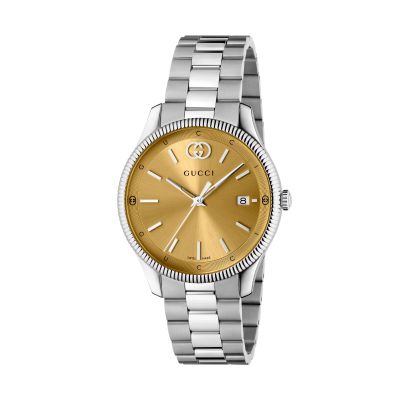 Gucci G-Timeless / orologio unisex / quadrante dorato / cassa e bracciale acciaio